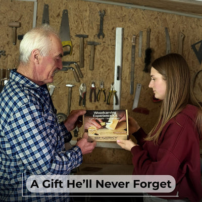 Beginner DIY Spoon Carving Kit with hand-forged knives, linden wood blanks, and carving tools laid out