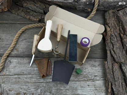 Beginner’s Spoon Carving Kit with sloyd knife, hook knife, wooden blank, sandpaper, sharpening board, pencil, and finger wrap