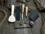 Beginner’s Spoon Carving Kit with sloyd knife, hook knife, wooden blank, sandpaper, sharpening board, pencil, and finger wrap