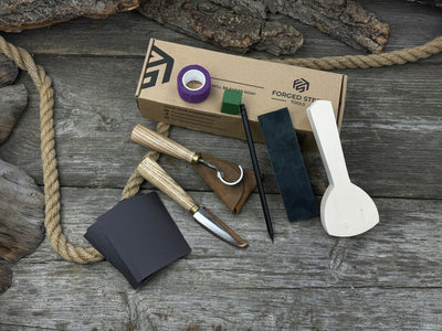 Beginner’s Spoon Carving Kit with sloyd knife, hook knife, wooden blank, sandpaper, sharpening board, pencil, and finger wrap