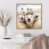 Square framed photo of nine curious polar bears close together, noses pointed at the camera against a snowy background under a partly cloudy sky.
