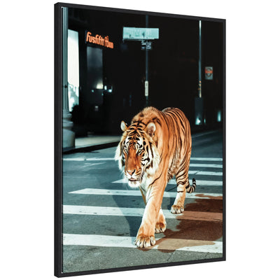 Sylvie Tiger in the City at Night 2 framed canvas art showing a tiger at night against a cityscape, by Michael Schauer