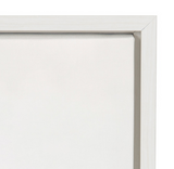 Close-up of a white wooden frame corner holding a taut white canvas, showing subtle texture and clean, minimal design.