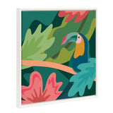 Bright stylized toucan with a multicolored beak perched amid large tropical leaves in shades of green, teal, pink, and coral on a framed canvas by Carey Copeland.