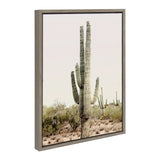 Framed canvas print featuring a tall saguaro cactus with multiple arms set in a desert landscape under a pale sky.