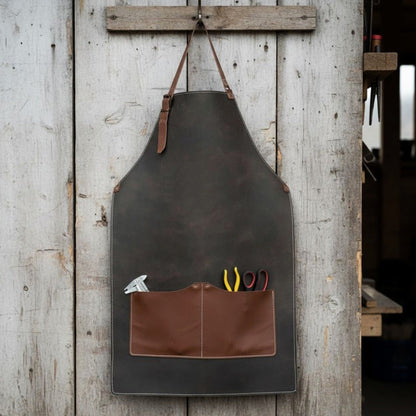Black leather work apron with adjustable straps and large front pockets
