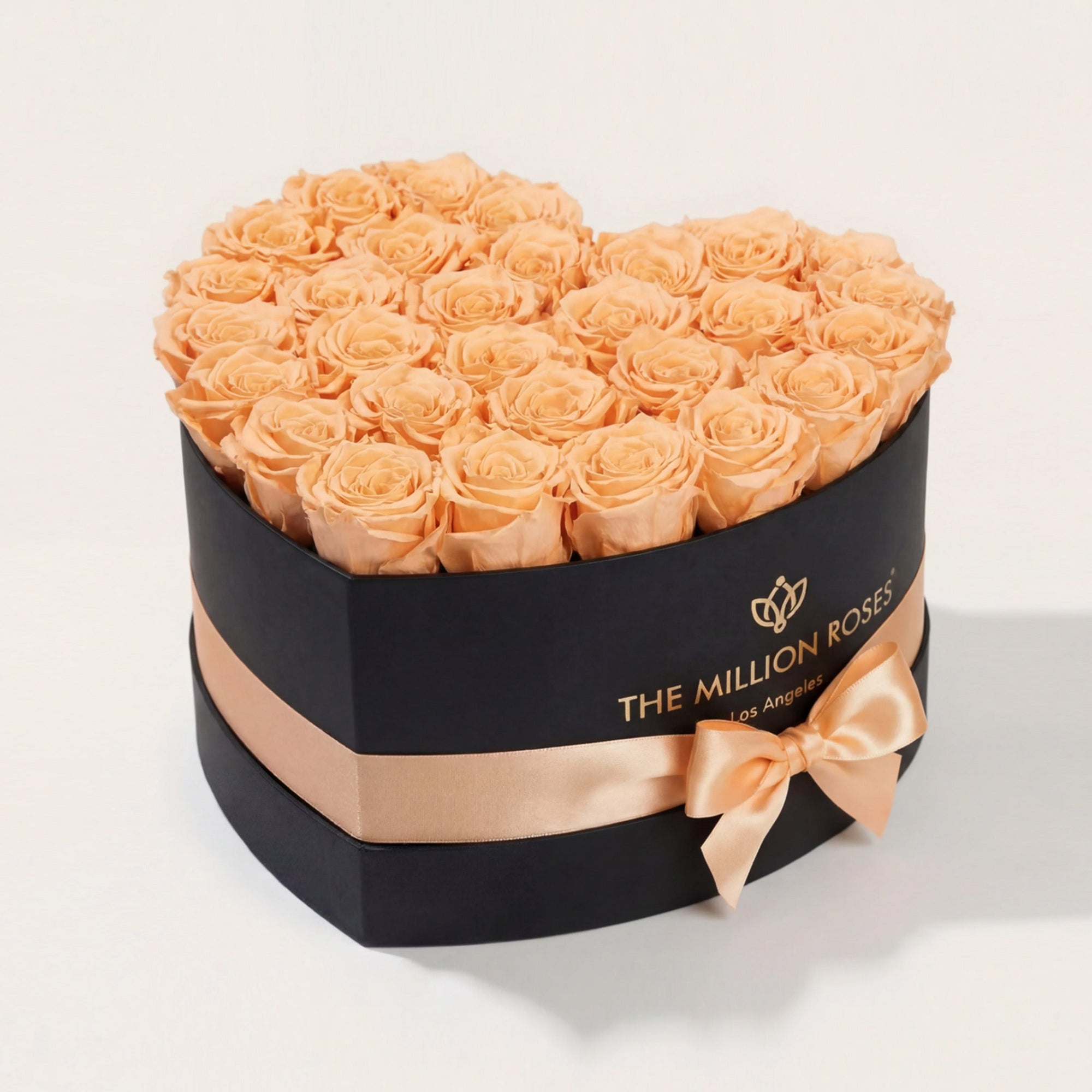 Heart Black Box with 28-30 peach roses arranged inside a heart-shaped black box