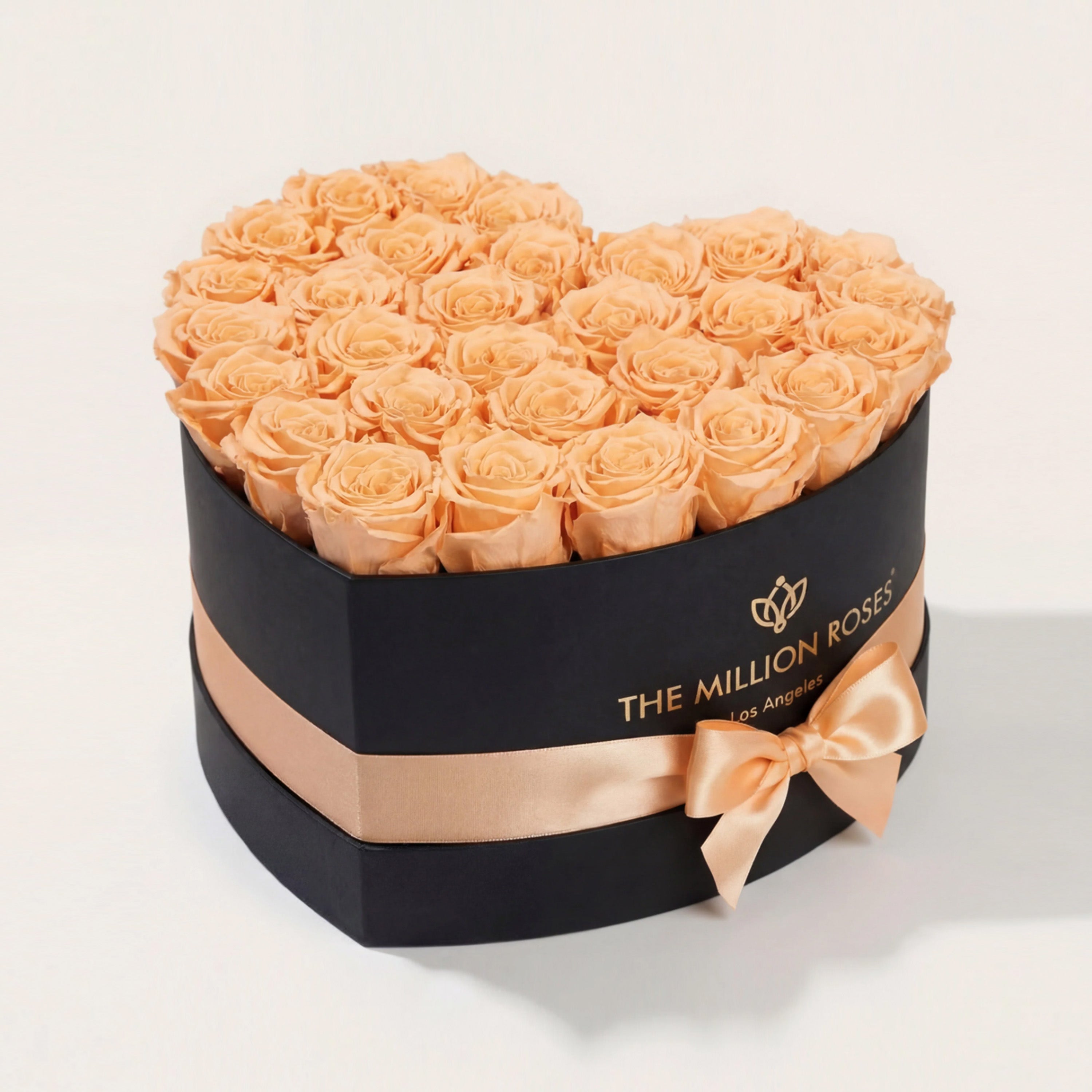 Heart Black Box with 28-30 peach roses arranged inside a heart-shaped black box