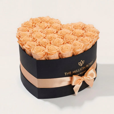 Heart Black Box with 28-30 peach roses arranged inside a heart-shaped black box