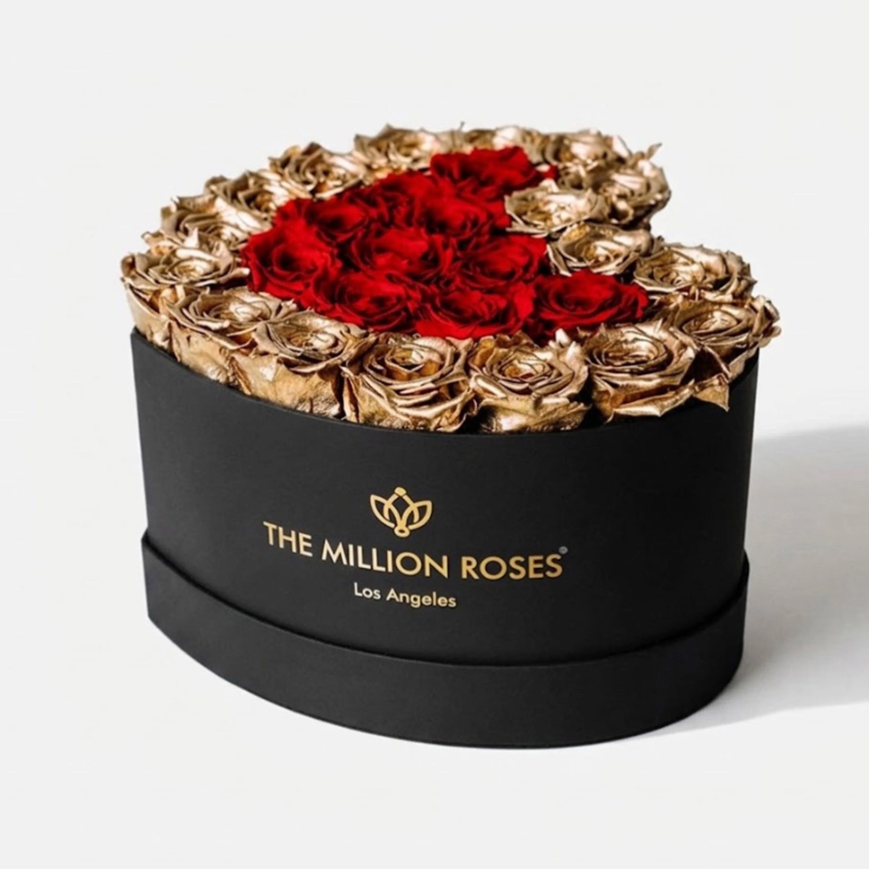 Black heart-shaped box with 28-30 red and gold roses inside