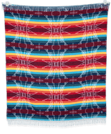 AwirítkAt (Summer) blanket displayed folded and hanging, showing its warm neutral colors and texture.