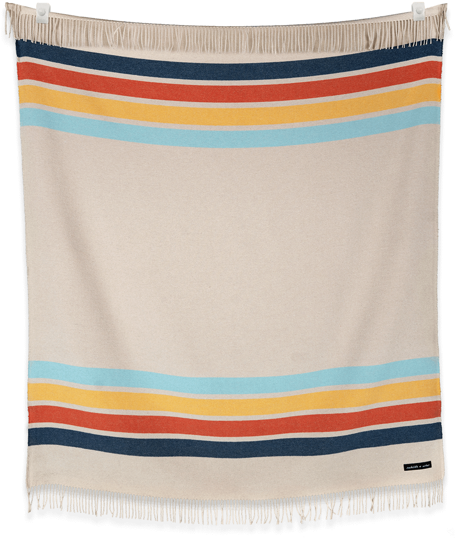 Camp Coast blanket folded and displayed in neutral tones