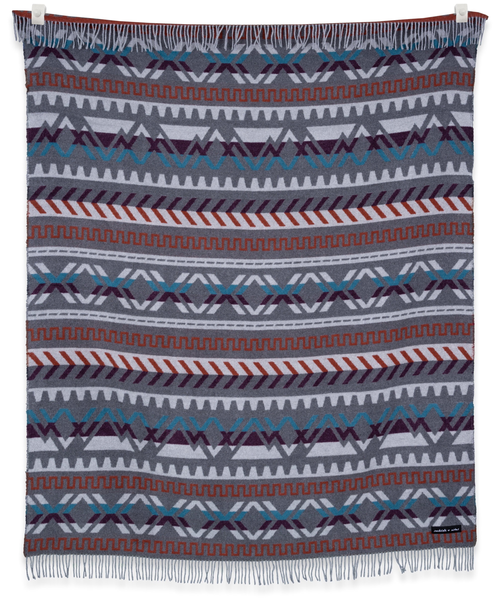 Ridgeline Tetons blanket folded and hanging, showing Fair Isle inspired pattern in warm neutral tones