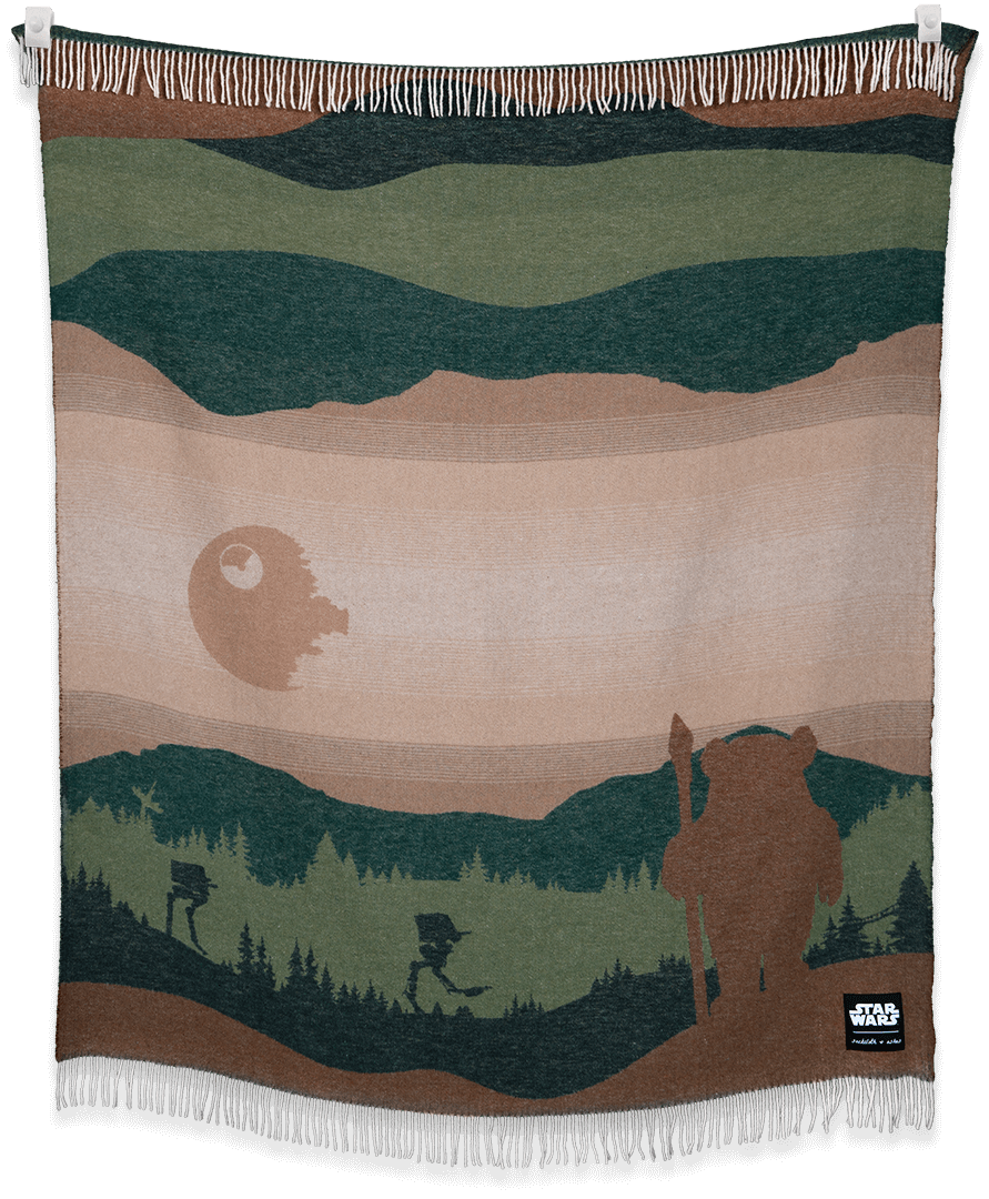 Star Wars Endor™ blanket showcasing forest moon design draped and styled in a living room setting