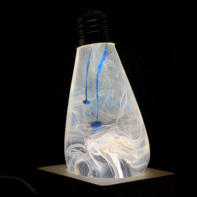 EP Light Blue-Drop Resin LED Bulb handcrafted with eco-friendly resin, shown with wooden base options