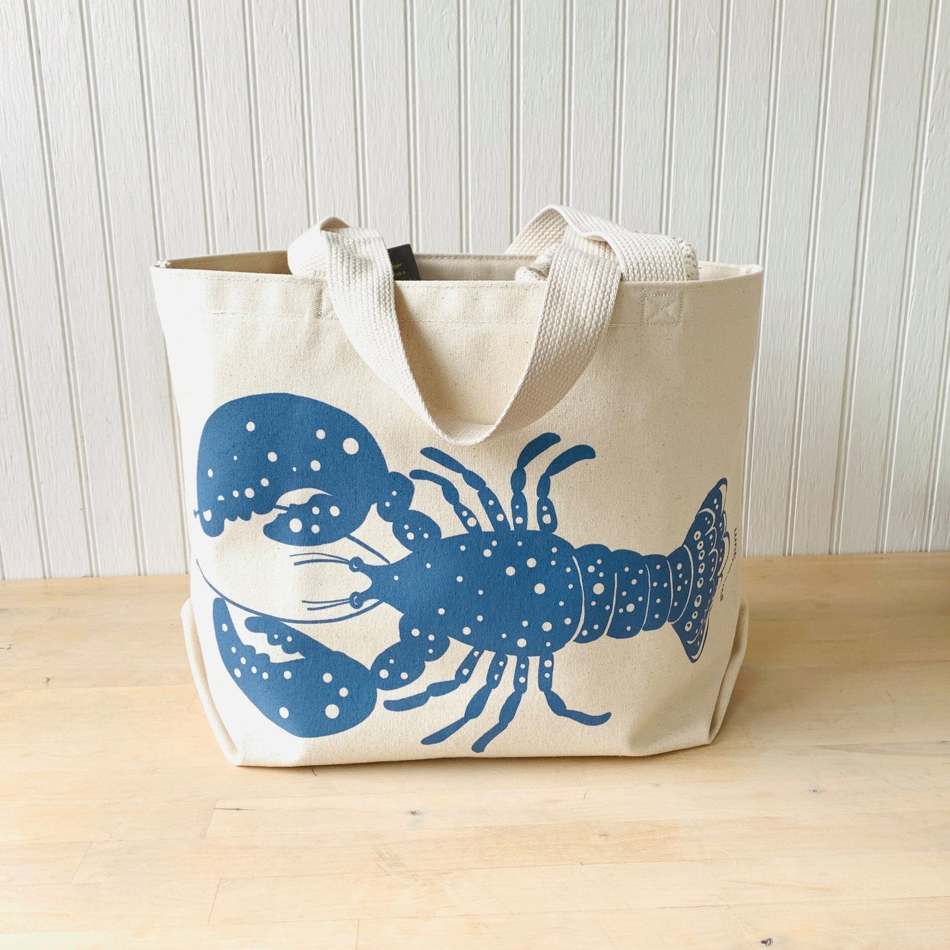Blue Lobster Large Canvas Tote Bag featuring a blue lobster print on natural canvas