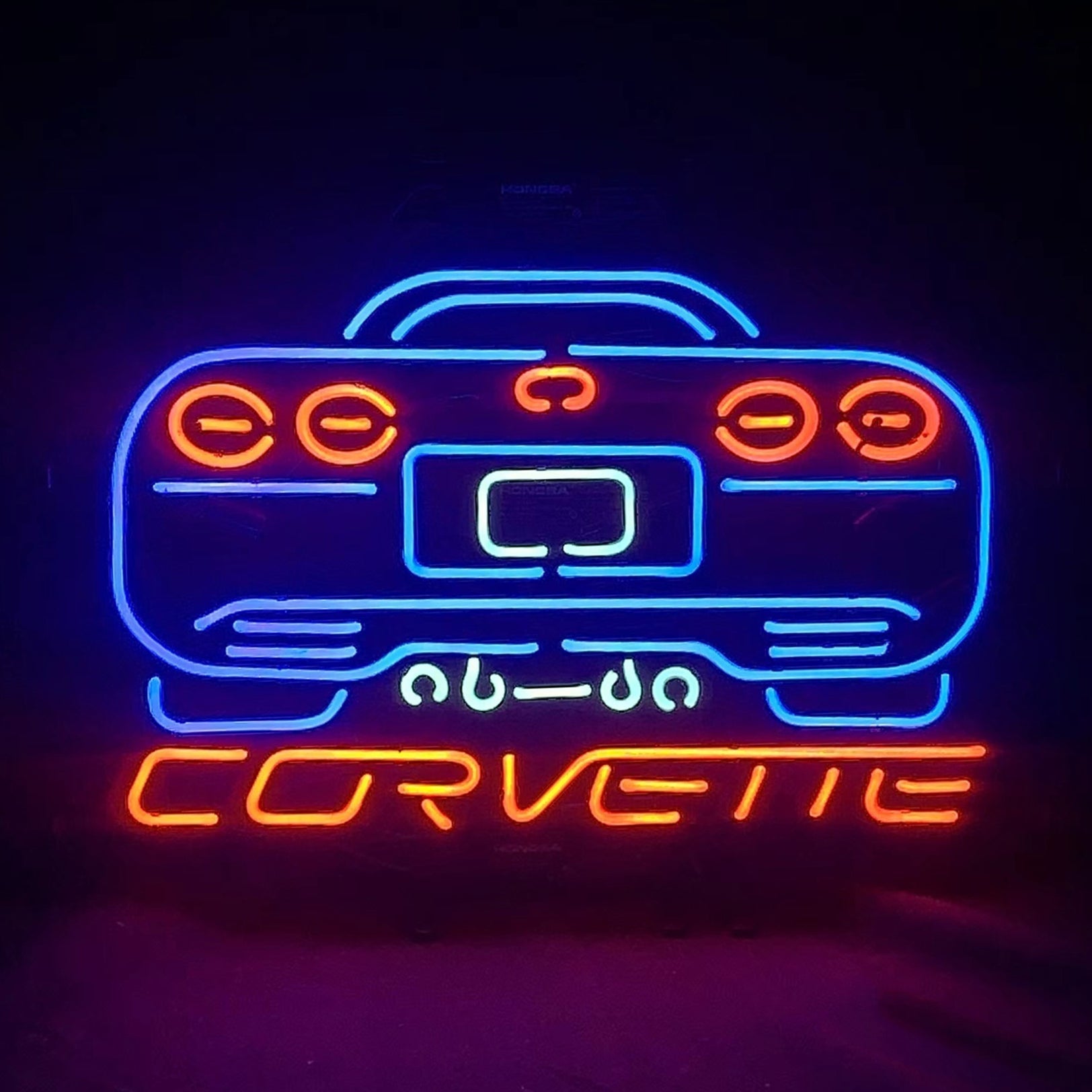 Blue neon sign shaped like a Corvette car motor mounted on a metal grid backing