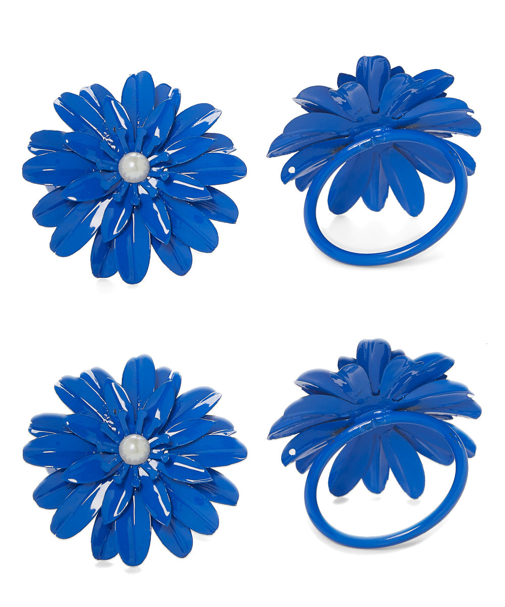 Set of 4 blue floral pearl napkin rings arranged on a table
