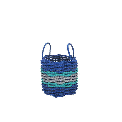 Handmade storage basket woven from blue, light gray, and teal lobster rope