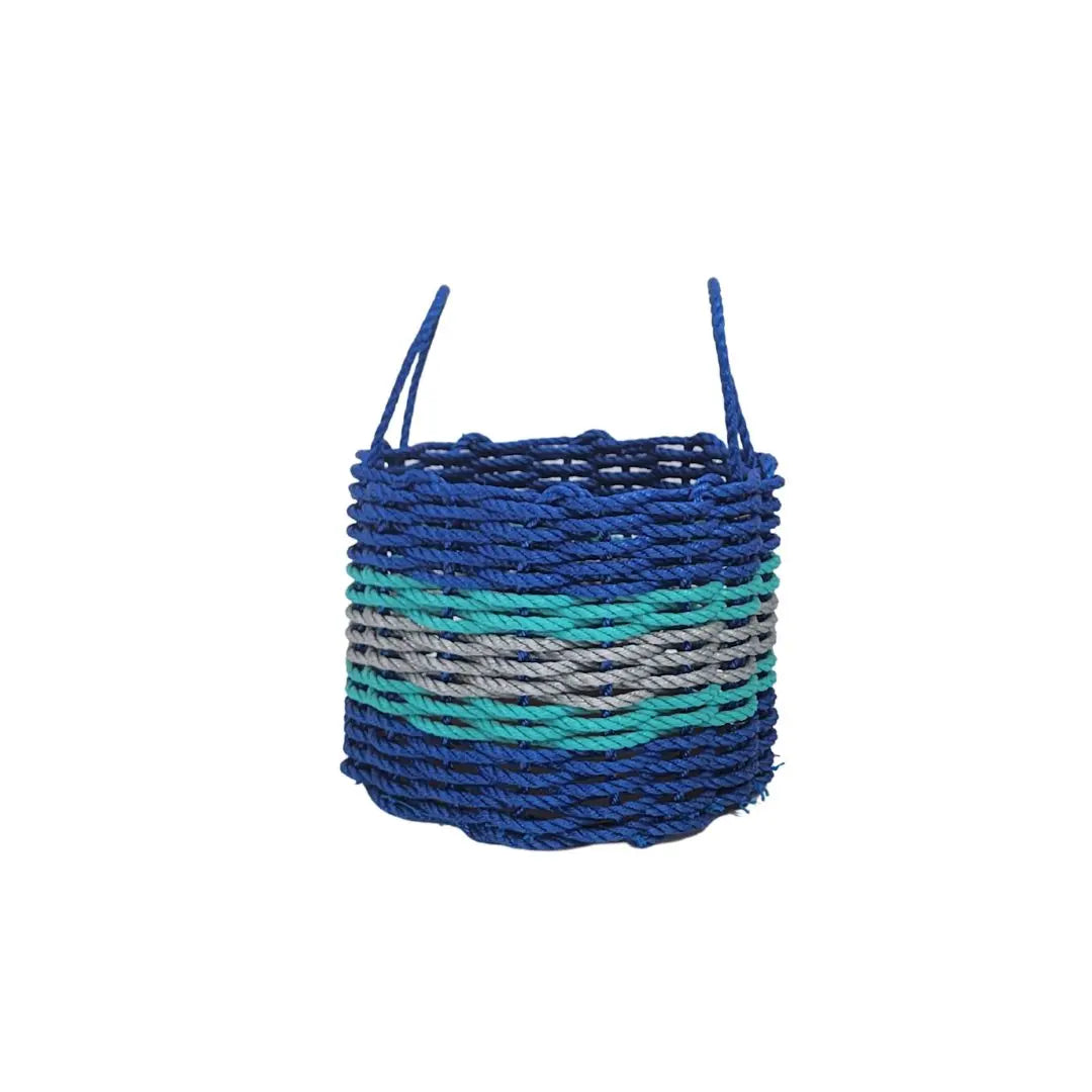 Handmade storage basket woven from blue, light gray, and teal lobster rope