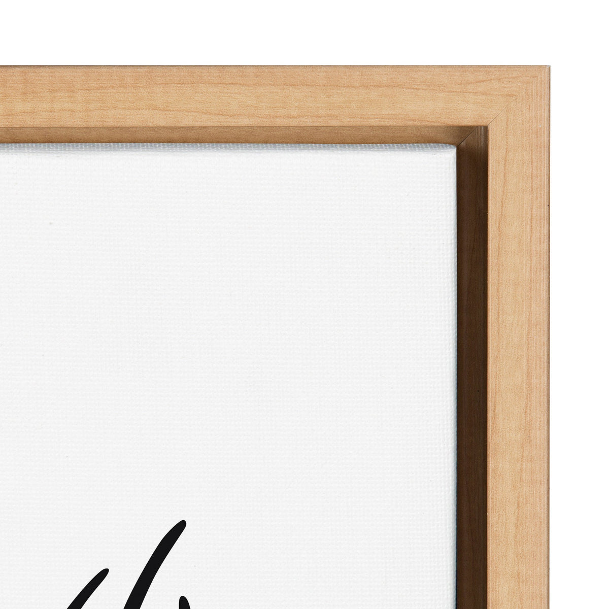 Close-up of a stretched white canvas framed by light natural wood with visible grain and clean mitered corners.