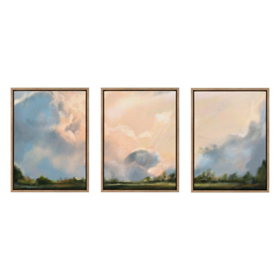 Sylvie Clouds Triptych Framed Canvas Art Set displayed on a white wall with soft cloudy imagery in gold frames