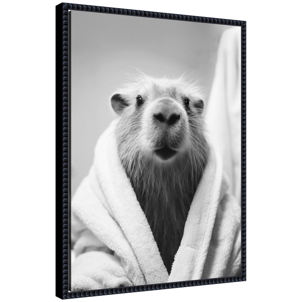 Black and white framed canvas art featuring a capybara wearing a towel robe by The Creative Bunch Studio