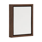 Rectangular 8x10 blank white canvas tightly fitted and set inside a dark brown wooden frame with recessed sides shown at a slight angle on white background.
