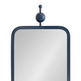 Rectangular mirror with rounded corners and a slim dark blue metal frame topped by a spherical and cylindrical finial centered above the frame.