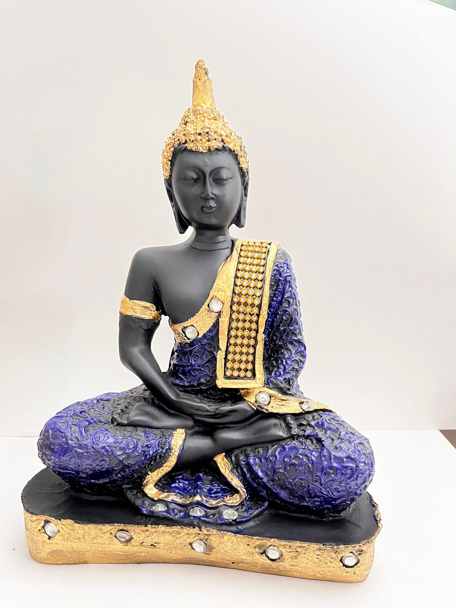 Polyresin Buddha Idol Statue Showpiece in blue and black on display