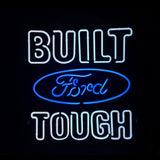 Built Ford Tough Neon Sign glowing in warm red neon on metal grid backing