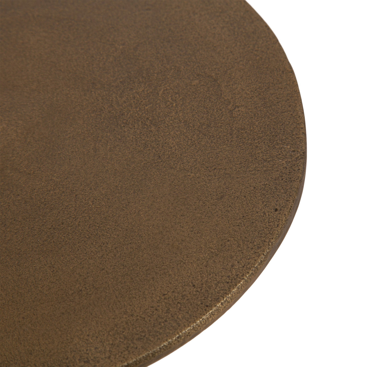 Close-up of round side table top with textured matte bronze metal surface and slightly beveled edge