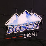 Neon sign featuring blue and white mountain peaks with the word 'Busch' in blue neon and 'Light' in white neon below on a black background.
