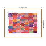 Colorful rectangular patchwork of brushstroke-like shapes in varied warm tones with dotted patterns, arranged on white background within a light wood frame.