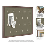Rectangular green pinboard with small white botanical motifs arranged evenly and two photos pinned, framed in warm brown wood grain.