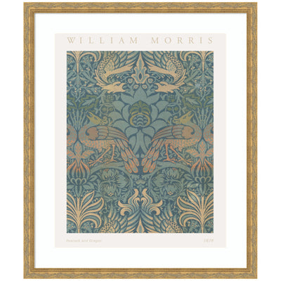 Framed art poster of William Morris Peacock and Dragon 1878 featuring peacocks and dragons in blues, greens, and oranges framed in vintage moulding.