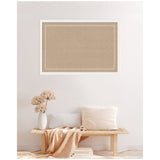 Rectangular natural cork pinboard with a white scalloped edge pattern, mounted on a pale wall above a wooden bench with neutral cushions and a beige throw.
