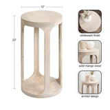 Tall round side table with a whitewashed solid mango wood finish and arched supports connecting the circular top and base, measuring 23 inches high and 12 inches wide.