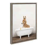Painting of a baby donkey standing in a clawfoot bathtub filled with bubbles, with a small yellow rubber duck, set on wooden floor against a pale background.