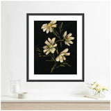 Framed painting of four cream-colored flowers with yellow centers and green stems on a black background, displayed above a minimalist white shelf with a glass and small vase of flowers.