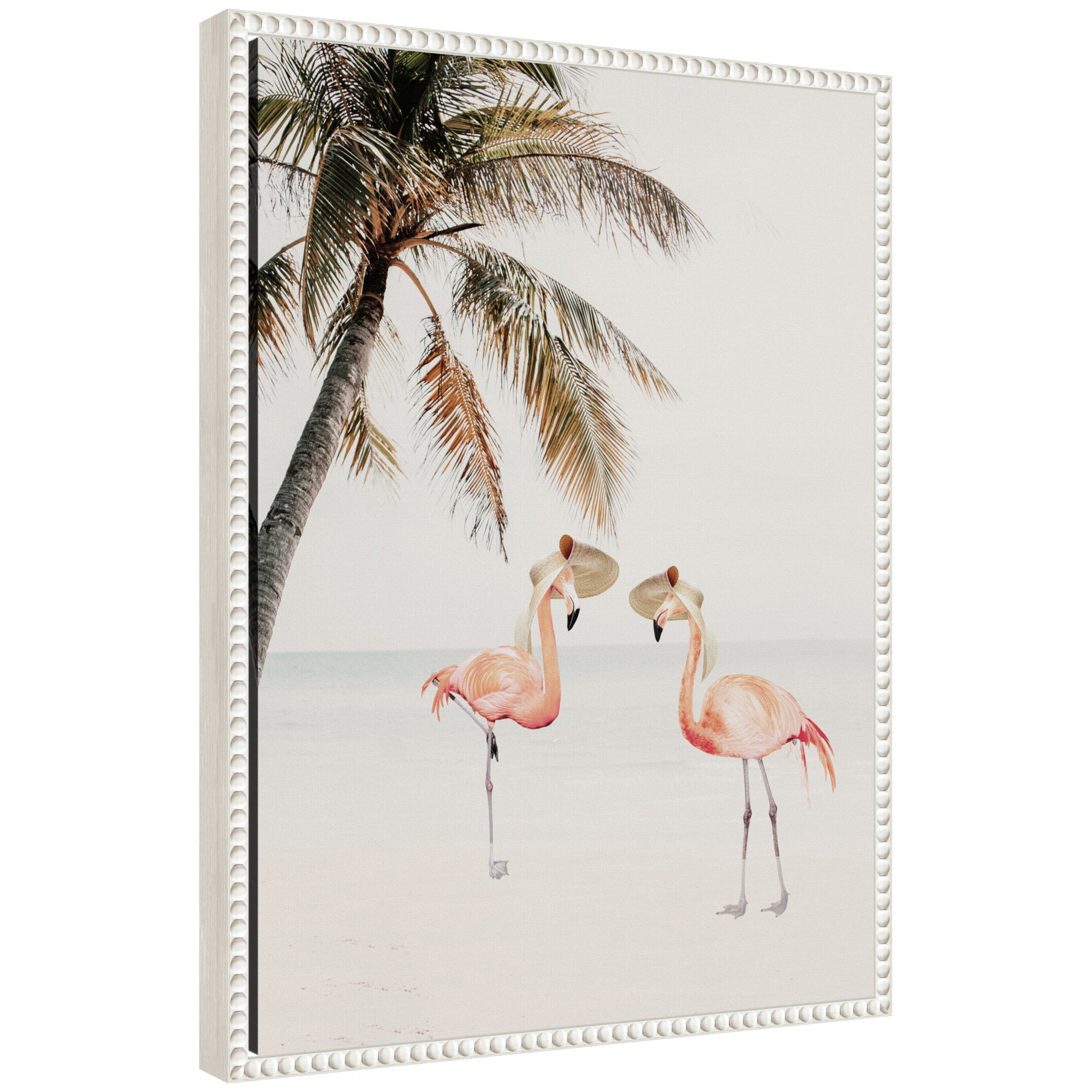Sylvie Flamingos on Vacation framed canvas artwork showing flamingos on pink sand with palm leaves