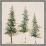 Abstract painting of three evergreen trees in muted green and brown tones on a neutral linen-textured background, framed in simple gray wood.