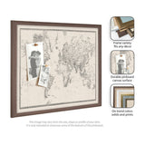 Framed pinboard featuring a vintage-style black and white world map printed on fabric with two pinned black and white photos, accented by a wood-toned frame.