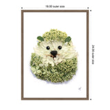 Framed canvas art depicting a hedgehog made from white and green flower petals with glossy black eyes and nose on a white background, measuring 18x24 inches.