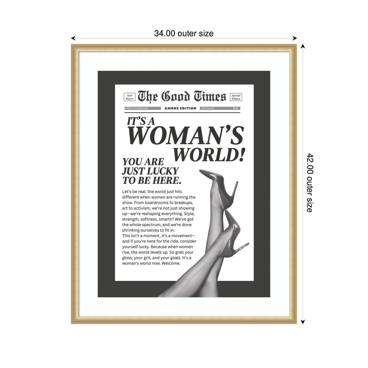 Black and white framed print styled as a vintage newspaper front page titled 'The Good Times' with headline 'It's a Woman's World!' and a photo of crossed legs in high-heeled shoes.