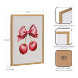 Print of two shiny red cherries with green stems tied by a large pink satin bow, framed in a natural oak wood frame with gold finish, shown with dimensions and hanging details.