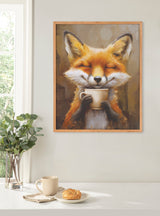 Framed painting of a smiling fox with closed eyes holding a white coffee cup, displayed on a cream wall above a table with a beige cup, croissant, and green plant.