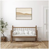 Neutral-toned abstract landscape print with layered beige, tan, and gray bands framed above a wooden bench with white cushions in a minimalist room with plant and textured rug.