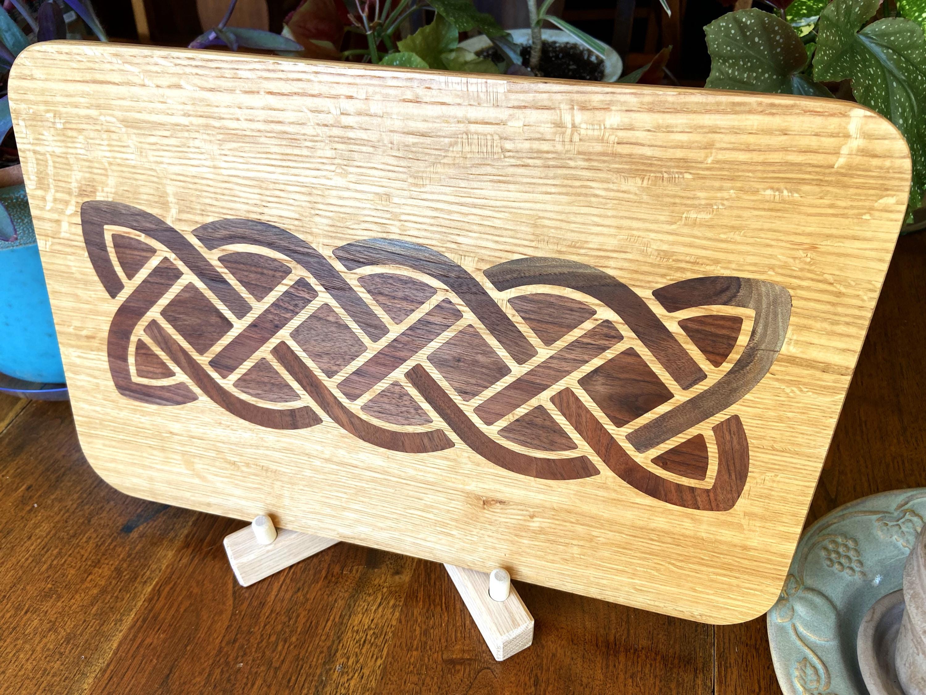 White Oak charcuterie board featuring a complex Celtic knot inlay made of Peruvian Walnut