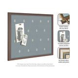 Rectangular pinboard with blue botanical print canvas and dark brown wooden frame, holding two black-and-white photos pinned with wooden clips.